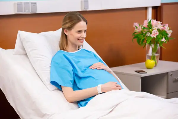 pregnant woman on hospital bed